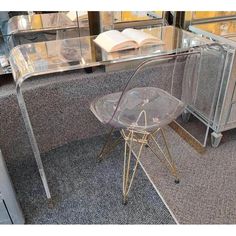 a clear chair sitting on top of a carpeted floor