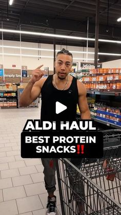 a man standing in front of a shopping cart with the words aldi haul best protein snacks