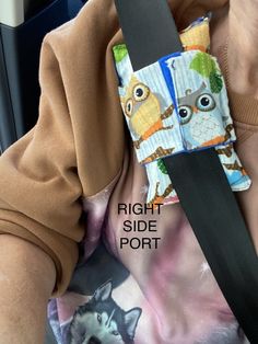 the seat belt has an owl print on it