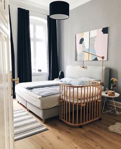 a baby crib sitting in the corner of a room