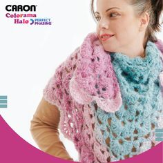 a woman wearing a pink and blue crocheted scarf with an elephant on it