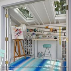 an open door leading to a room with white walls and blue flooring on the outside