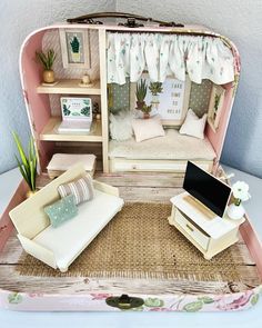 a doll house with furniture and accessories in it