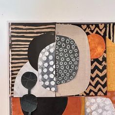 an abstract painting with black, white and orange shapes