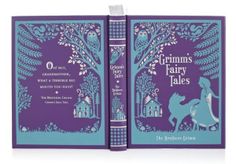 an open purple book with blue pages and illustrations on the cover, which reads gumms fairy tales