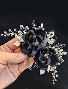 This Black Flower Comb is crafted from natural silk, making it the perfect Gothic wedding hair piece. The elegant design adds a unique touch to any bridal look. Measuring approximately 6 inches in length and 2.8 inches in width, this comb is lightweight and flexible, ensuring comfort throughout the day. You can customize your comb by selecting different flower colors or metal finishes from the drop-down list. For a complete bridal party look, pair this comb with matching bridesmaids' hairpins. Elevate your Gothic wedding style with this stunning Black Flower Comb. Mother Of The Bride Hair Black Crystal Hair Comb, Black Hair Piece, Gothic Wedding Hair, Goth Hair Accessories, Black Hair Pieces, Black Wedding Veil, Gothic Hair, Black Hair Accessories, Matching Bridesmaids