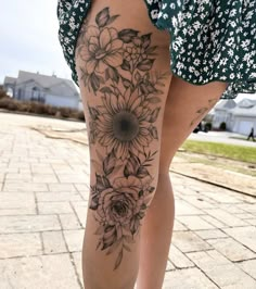 a woman's leg with flowers on it