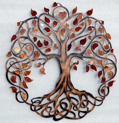 a metal tree with red leaves and swirls on it's branches is mounted to the wall