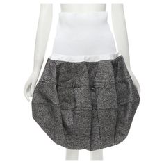 LOUIS VUITTON 2021 Runway white ribbed grey wool dropped bubble skirt FR34 XS Reference: AAWC/A00010 Brand: Louis Vuitton Designer: Nicolas Ghesquiere Collection: Fall Winter 2021 - Runway Material: 100% Wool Color: Grey, White Pattern: Solid Extra Details: Ribbed stretch waist band with internal grosgrain ribbon strap. Grey wool-tweed. 3D bubble cut. Dropped waist skirt silhouette. CONDITION: Condition: Excellent, this item was pre-owned and is in excellent condition. SIZING Designer size: FR34 Short Flared Skirt, Drop Waist Skirt, Louis Vuitton Store, Louis Vuitton Designer, Bubble Skirt, Nicolas Ghesquiere, Lv Monogram, Vintage Louis Vuitton, Louis Vuitton Shoulder Bag