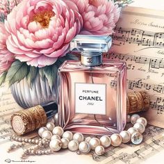 a bottle of perfume next to pearls and flowers