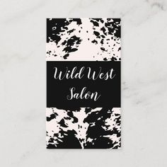 black and white paint splattered business card with the words wild west salon on it