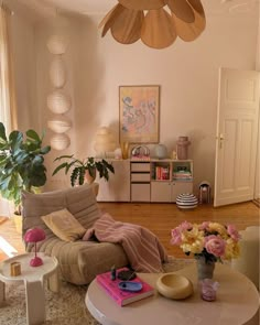 a living room filled with furniture and flowers