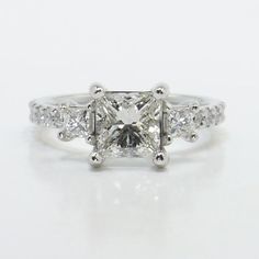 a princess cut diamond engagement ring with side stones