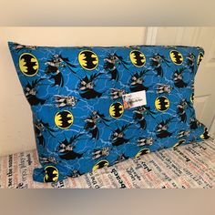 the batman pattern is on this blue pillow