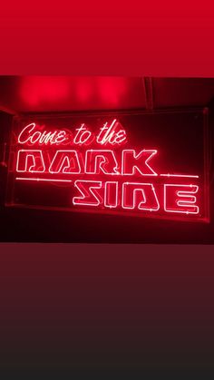 a neon sign that says come to the mark side