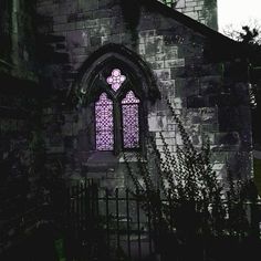 an old building with a stained glass window