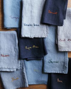 many different types of linens with embroidered names on the front and back of them