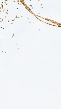 gold confetti falling from a white background