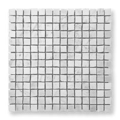 a white tile with grey squares on it