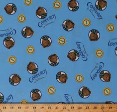 a blue fabric with brown bears on it and the words teddy bear in gold letters