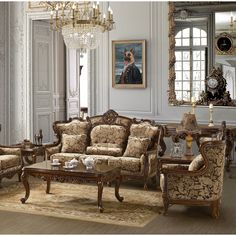 an elegant living room with fancy furniture and chandelier