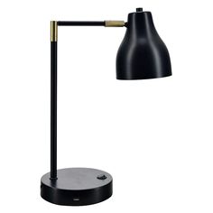 a black and gold desk lamp on a white background, with the light turned off