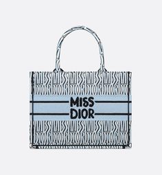 Medium Dior Book Tote Pale Blue and Black Miss Dior Allover Embroidery (36 x 27.5 x 16.5 cm) | DIOR Graffiti Signature, Limousine Car, Marc Bohan, Dior Aesthetic, Dior Book, Dior Star, Maria Grazia Chiuri