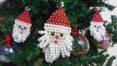 three christmas ornaments hanging from a tree