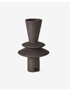 three stacked vases sitting on top of each other in front of a white background