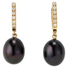 The Black Pearl and Diamond, ear pendants are crafted in 18K yellow gold, hallmarked in Cyprus. These elegant, ear pendants come in a highly polished finish and feature a pair of Black, treated, fresh water Pearls and white Diamonds totaling 0,12 Cts. They are incredibly easy to put on and take off, making them the perfect accessory for any occasion. Whether you are dressing up for a formal event or adding a touch of sophistication to your everyday look, these pendants are sure to impress. The B Luxury Black Round Pearl Earrings, The Black Pearl, Fresh Water Pearls, Water Pearls, Black Pearl, White Diamonds, Cyprus, Diamond White, Gold Black