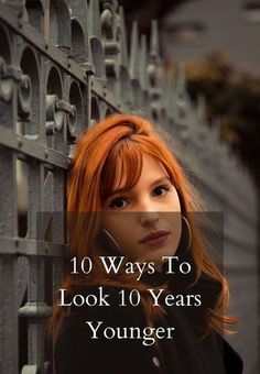 a woman leaning against a fence with the words 10 ways to look 10 years younger