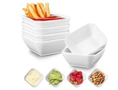 four bowls with different types of food in them and one bowl filled with french fries