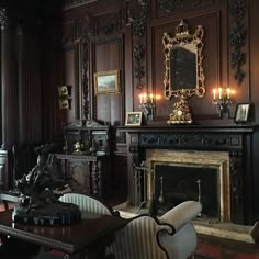 a living room filled with furniture and a fire place next to a wall mounted clock