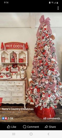 the christmas tree is decorated with red and white decorations, including an old fashioned candy machine