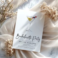 a white card with a martini glass on it