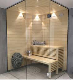 a wooden bench sitting inside of a sauna