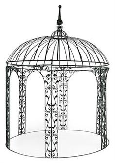 a black and white photo of a metal gazebo with intricate designs on the sides