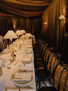 a long table set up for a formal dinner