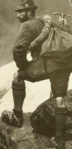 an old black and white photo of a man holding a baseball bat on top of a mountain