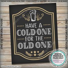 a sign that says have a cold one for the old one, on a wooden background