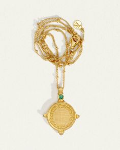 The Sura Necklace in cross-brushed 18K Gold Vermeil is reminiscent of an ancient coin with its embossed detail and circular shape. Set upon a fine chain enhanced by delicate gold bead elements. A faceted emerald, a quintessential symbol of love, at the tip of 4 symmetrical points completes the design. The Sura Necklace allows you to be open to receiving love from others. Receiving Love, Birthday Stone, Stone Properties, Necklace Emerald, Gemstone Properties, Ancient Coin, Byron Bay Australia, Gold Vermeil Jewelry, Vermeil Jewelry