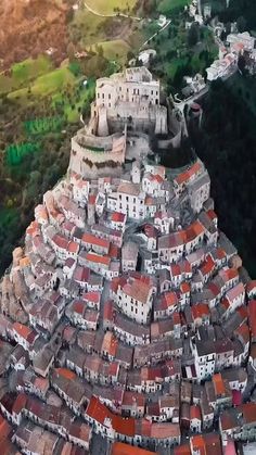 an aerial view of a city with red roofs