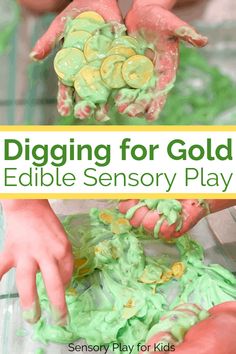 a close up of a child's hands with green and yellow play dough on it