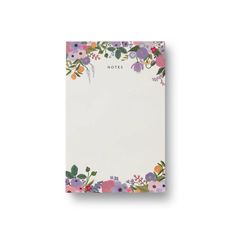 a notepad with flowers and leaves on the front, in white paper that says notes