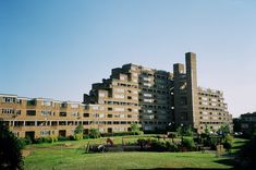 an apartment building with many windows and balconies