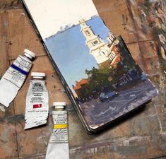 an artist's palette and some paint sitting on top of a table