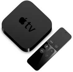 an apple tv sitting next to a remote control