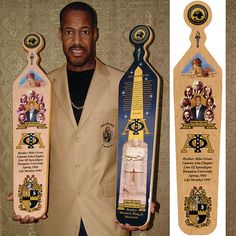 a man is holding two award plaques in his hands