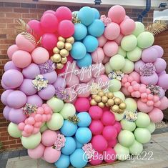 a bunch of balloons that are in the shape of a heart