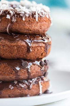 three chocolate donuts stacked on top of each other